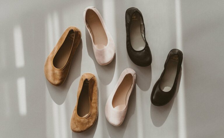 A flat lay of 3 different pairs of pretty barefoot ballet flats in regular and wide width from Groundies barefoot shoes